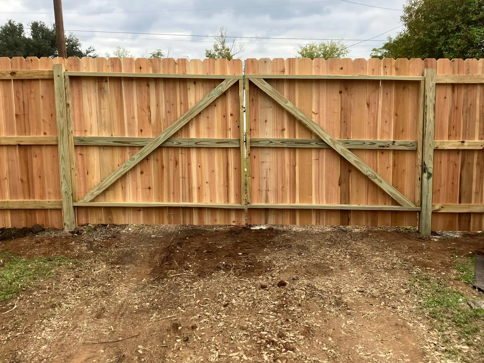 Custom wooden gate with welded metal frame