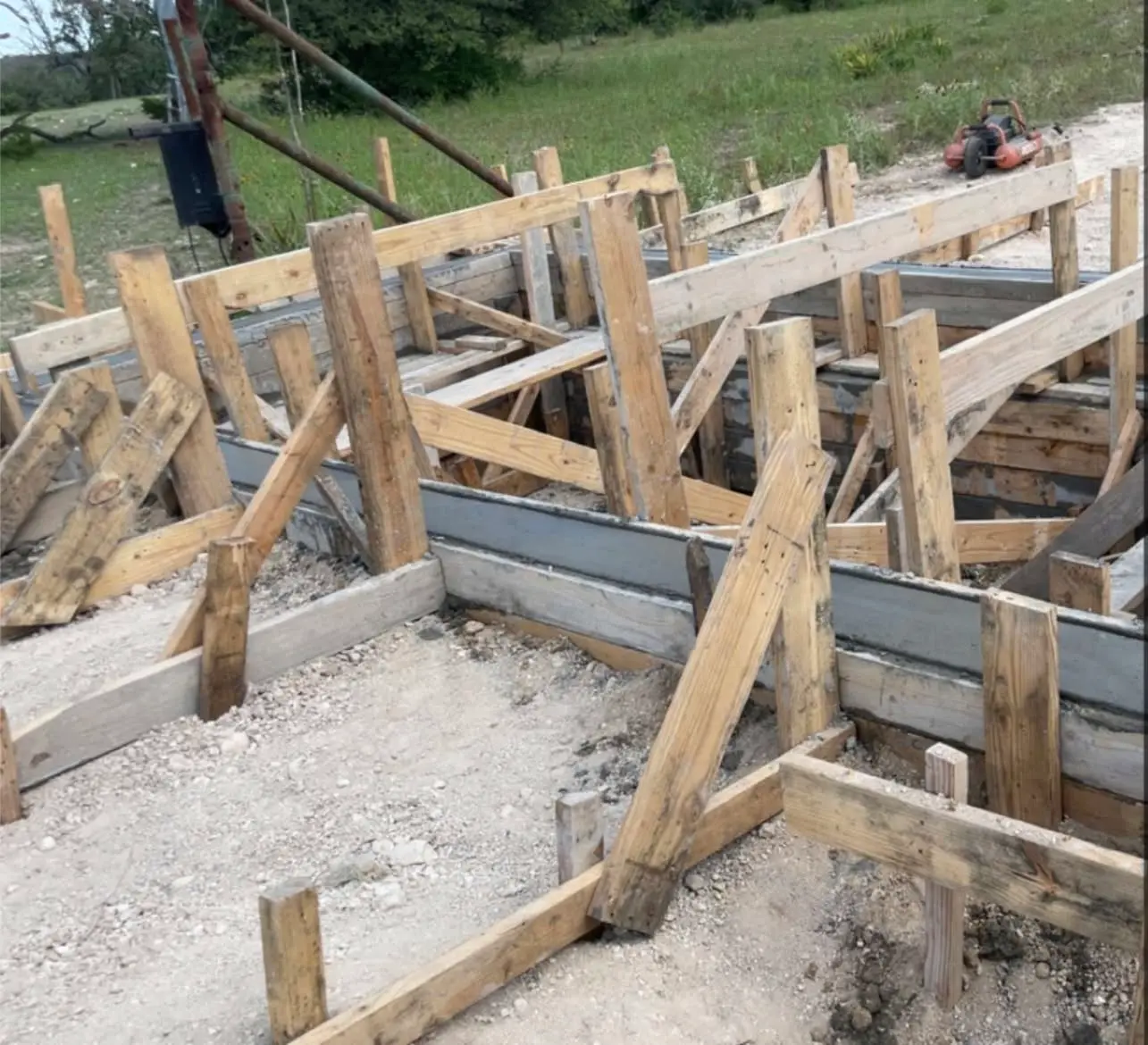 Wood-formed concrete foundation work prepared for a residential build in Burnet