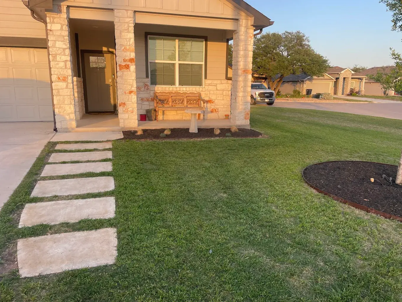 Freshly mowed and edged residential lawn maintained by VP Welding's property crew